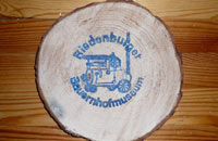 Holzscheibe mit Stempel vom Hof