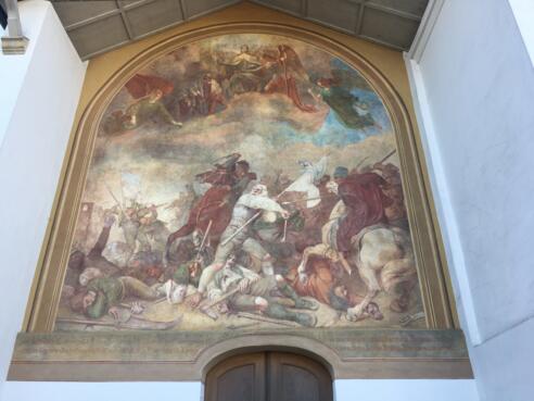 Fresko mit einer Darstellung der Sendlinger Mordweihnacht 1705 von Wilhelm Lindenschmit an der Außenwand der Alten Pfarrkirche St. Margaret