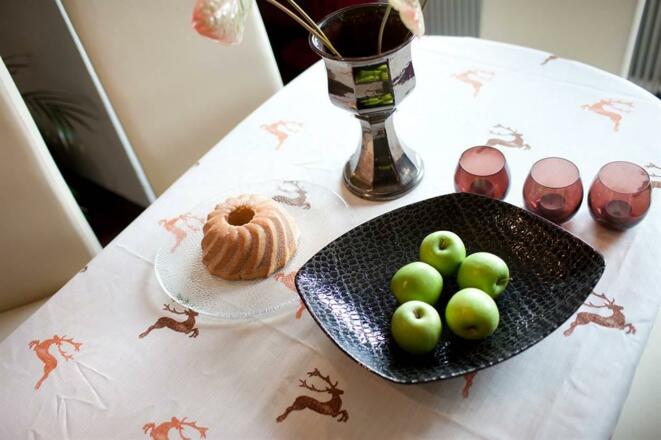 welcome with cake and apple, flowers and wine