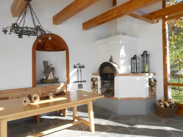 Wintergarten mit offenem Kamin