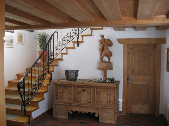 Treppenaufgang zu den Zimmern