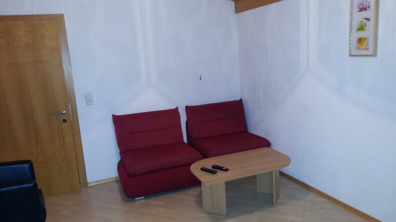 Wohnzimmer mit Schlafsofa