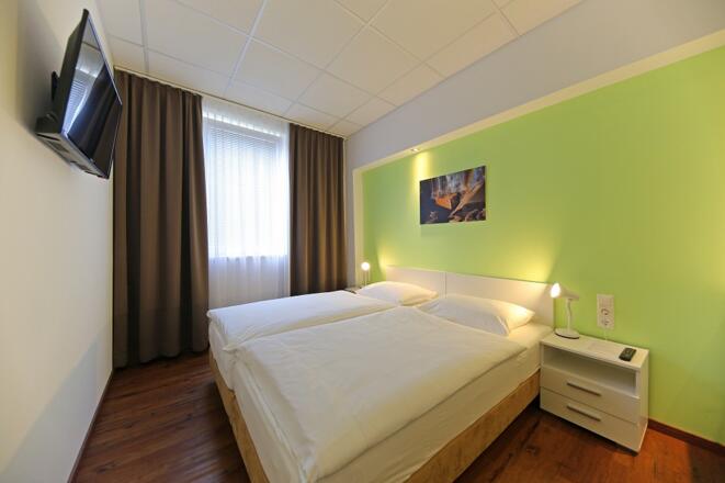 MontageHotel Business &amp; City Zimmer